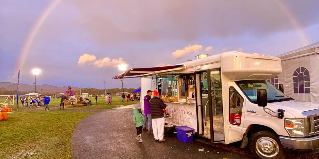 Neighborhood Kitchen food truck under rainbow